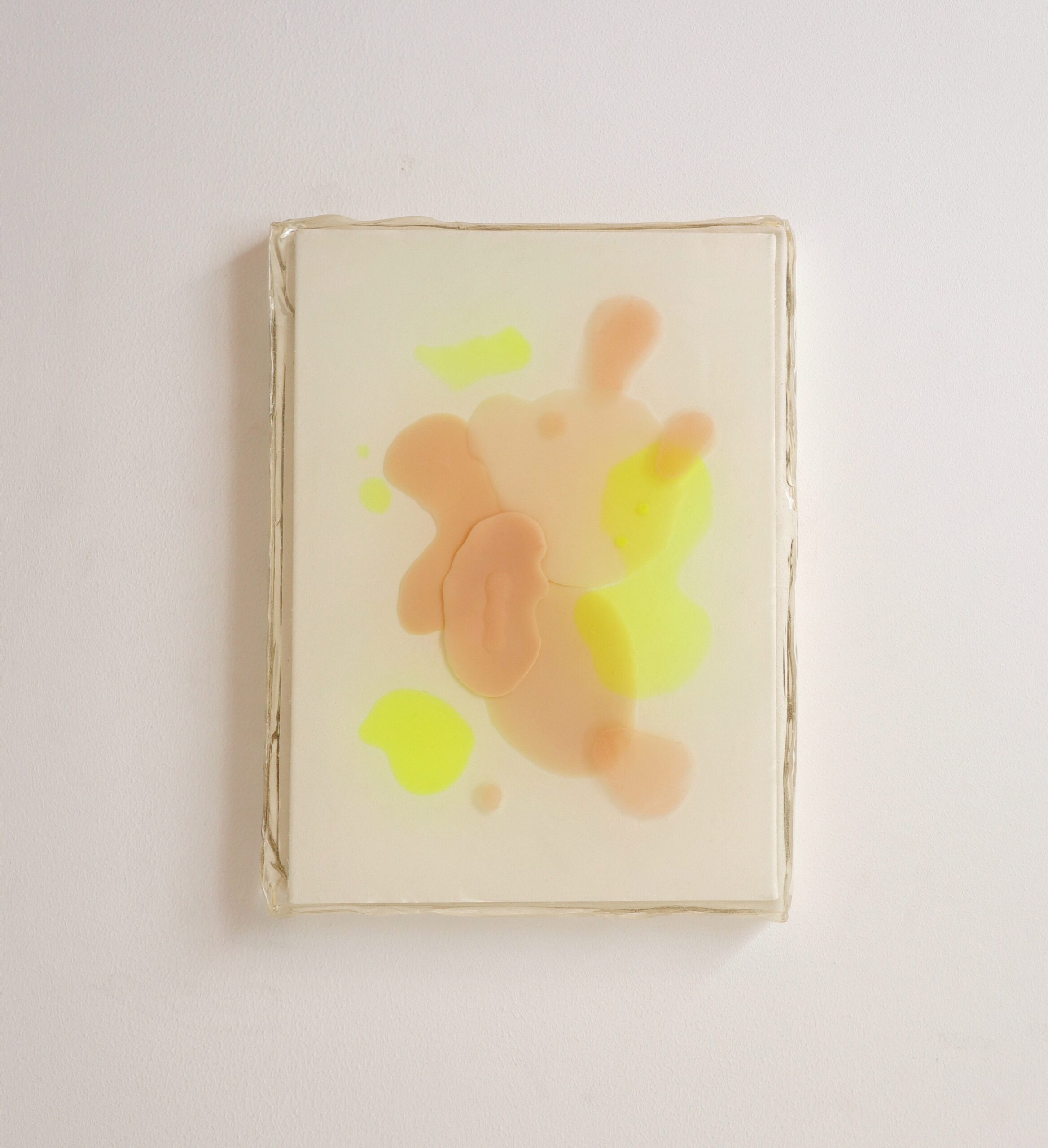 Abstract resin painting with soft peach and lime green blobs on a beige canvas, framed with a rough edge, set against a white background. Calm, minimalist tone.