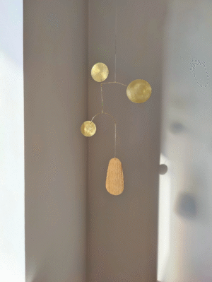 mid-century modern wood kinetic mobile and brass kinetic mobile - hanging mobile sculpture that creates gentle motion and make a serene addition to nursery, bedroom, living room of any contemporary interior design